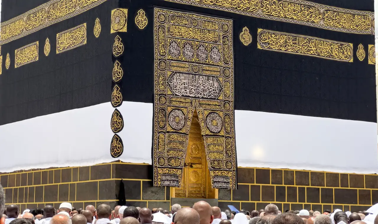 Pakistani pilgrim family in Ihram preparing for Umrah